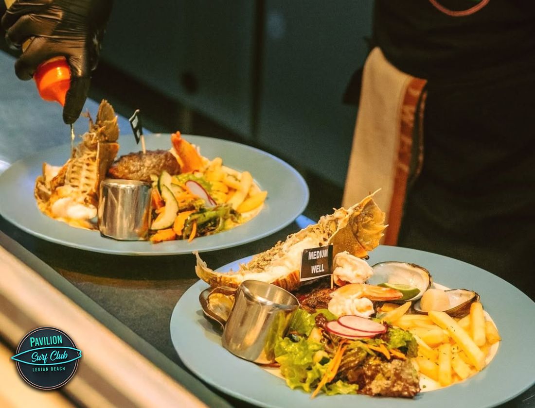 Delicious dinner by the ocean at a Bali beachfront restaurant Delicious dinner by the ocean at a Bali beachfront restaurant