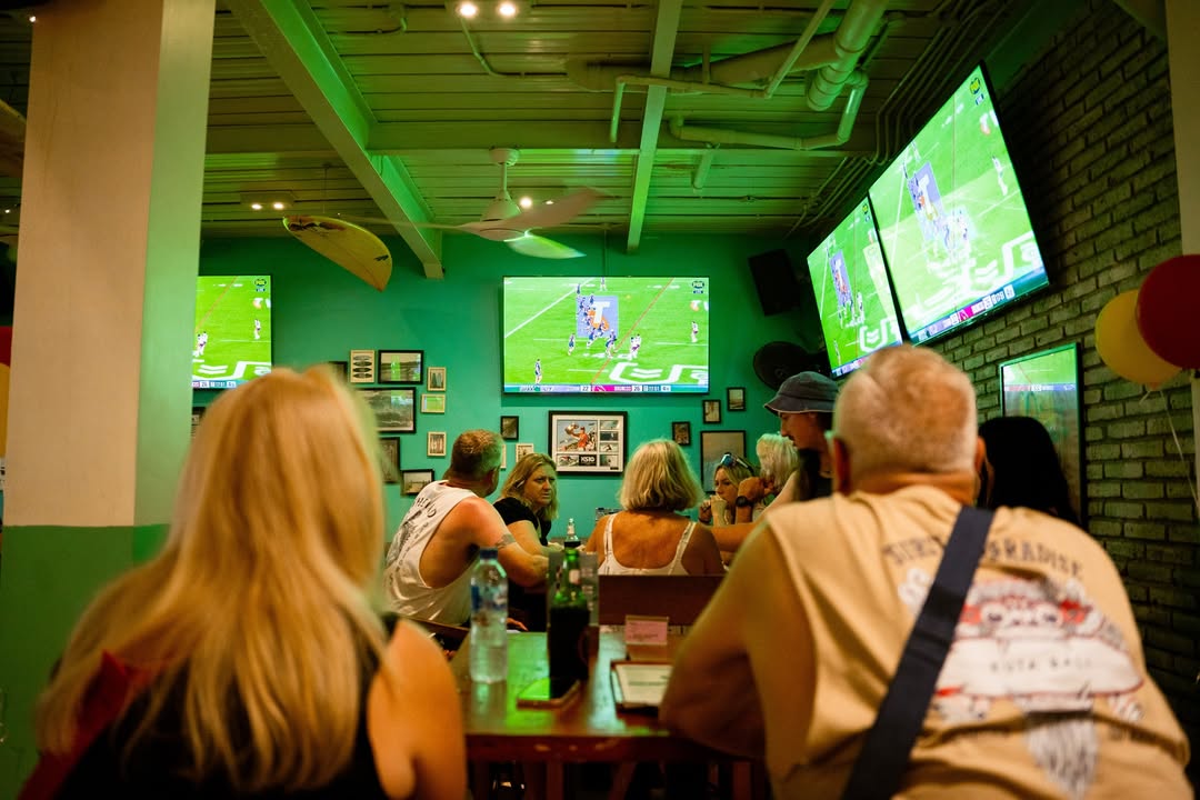 affordable-eats-legian-sports-bar Guests enjoying cold drinks and affordable meals while watching sports at Pavilion Surf Club, Legian