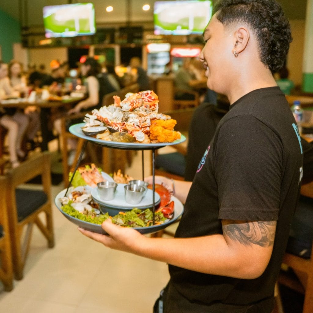 Staff serving food at Pavilion Surf Club