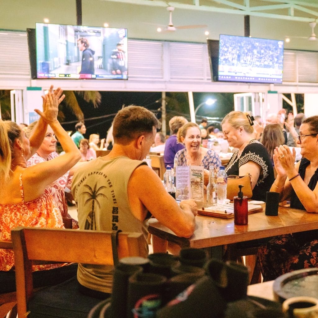 Guests enjoying the beachfront sports bar in Legian