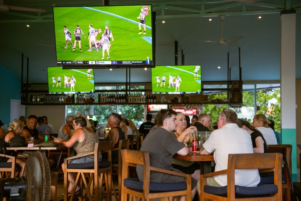 Sports fans watching live games at Pavilion Surf Club