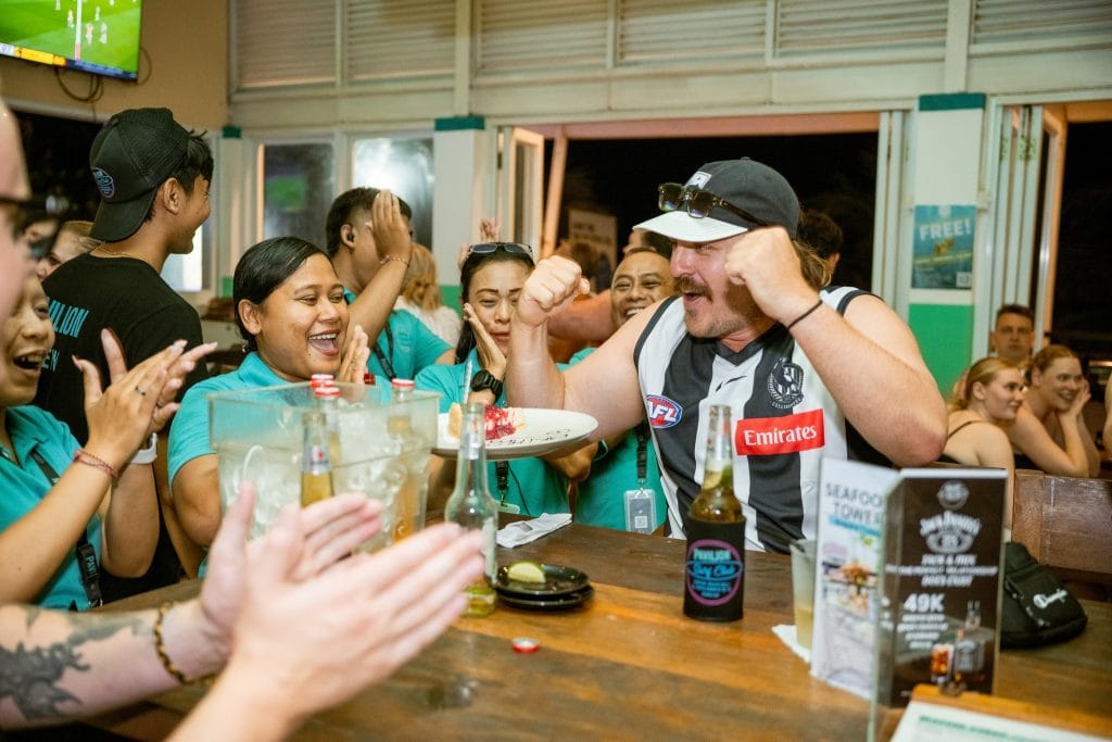 Friends enjoying drinks and food at Pavilion Surf Club