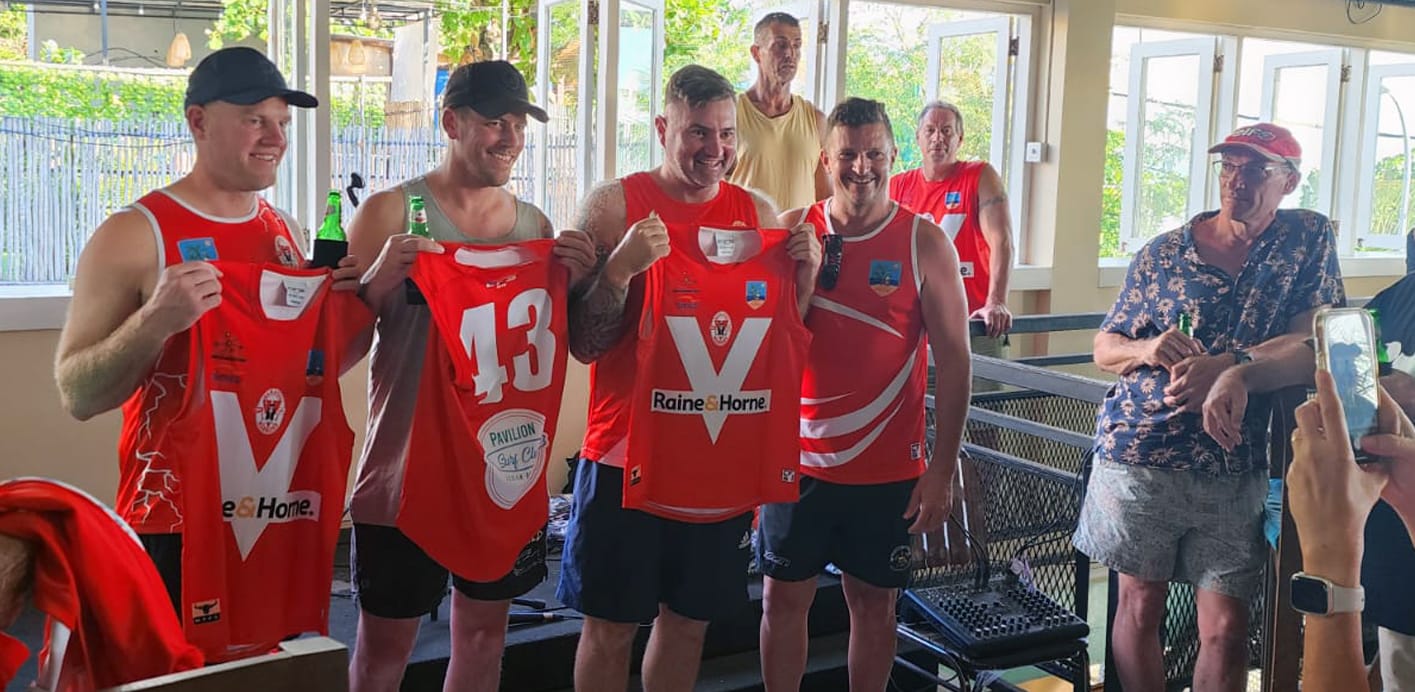 Local sports team holding Pavilion Surf Club sponsored jerseys in Bali