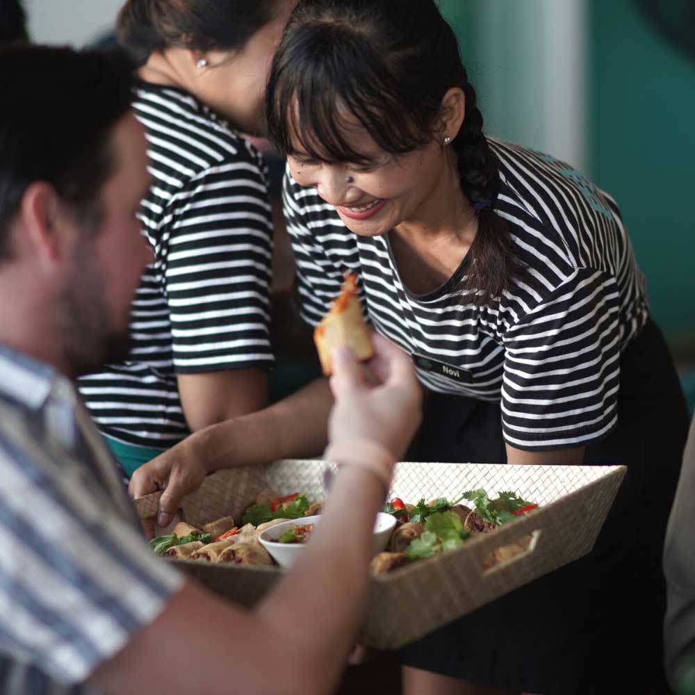 Friendly table service during a Pavilion Surf Club celebration