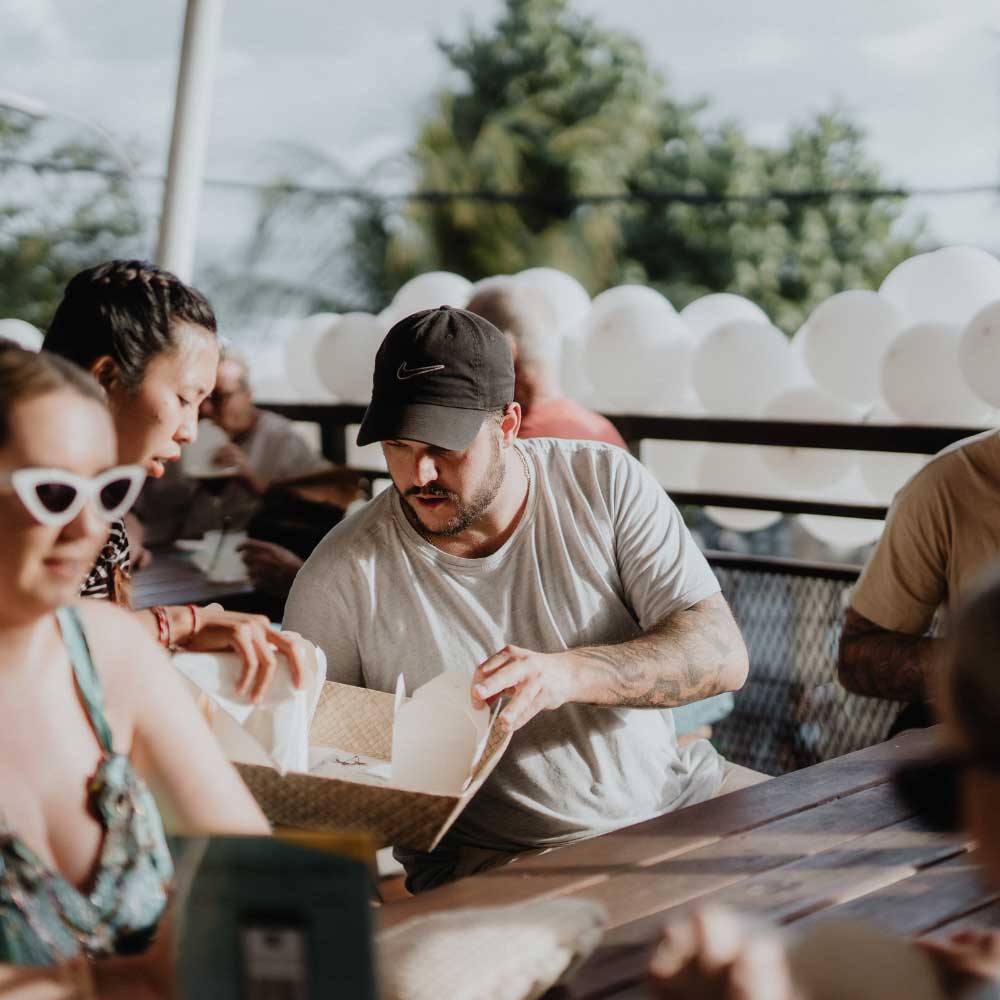 Guests dining together at Pavilion Surf Club Legian